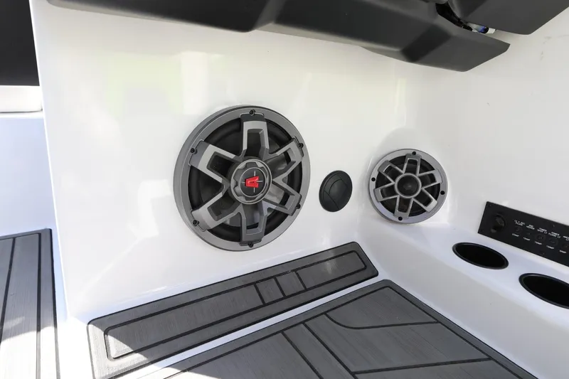 Slide: The Image of 2019 Axis T22 boat interior with built-in speakers and control panel. - 10