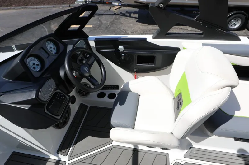 Slide: The Image of 2019 Axis T22 boat interior with steering wheel and white seat. - 11