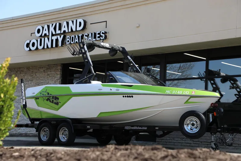 Slide: The Image of 2019 Axis T22 boat displayed at Oakland County Boat Sales dealership. - 14