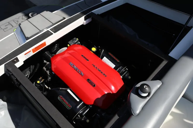 Slide: The Image of 2019 Axis T22 boat engine compartment featuring a Monsoon 409 engine. - 16