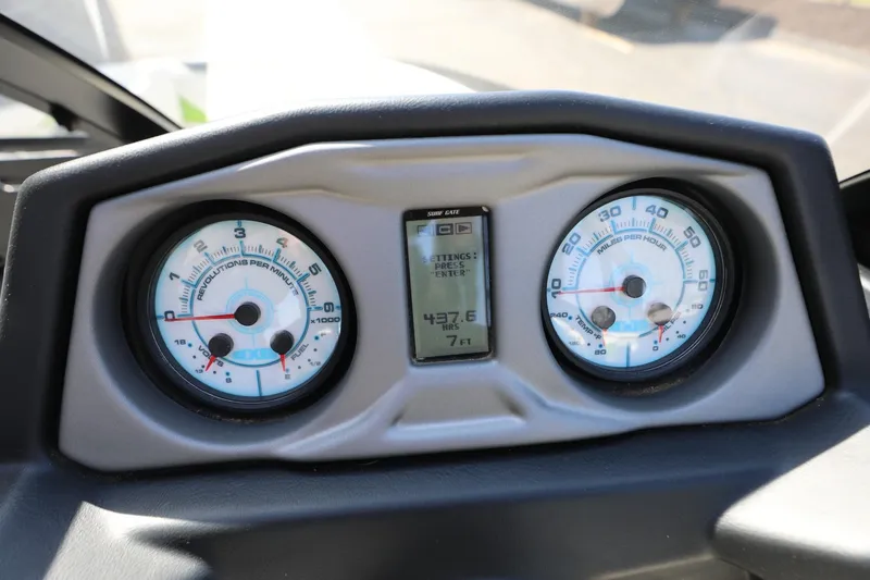 Slide: The Image of Dashboard of a 2019 Axis T22 boat showing RPM and speed gauges. - 8