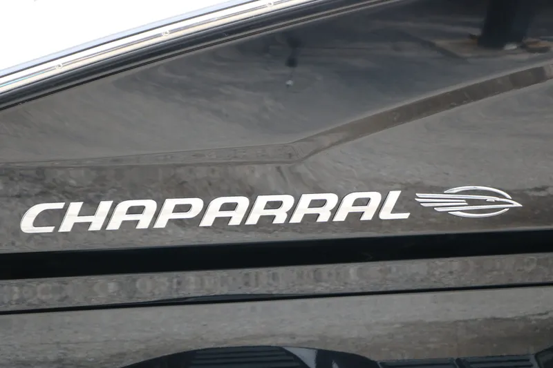 Slide: The Image of Chaparral 21 SSi 2026 boat logo on black background. - 10