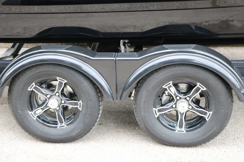 Slide: The Image of 2026 Chaparral 21 SSi trailer wheels with stylish rims. - 14
