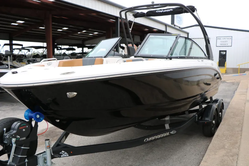 Slide: The Image of 2026 Chaparral 21 SSi boat on trailer outdoors. - 21