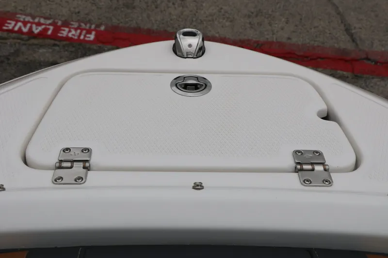 Slide: The Image of Chaparral 21 SSi 2026 boat hatch with hinges and handle. - 29