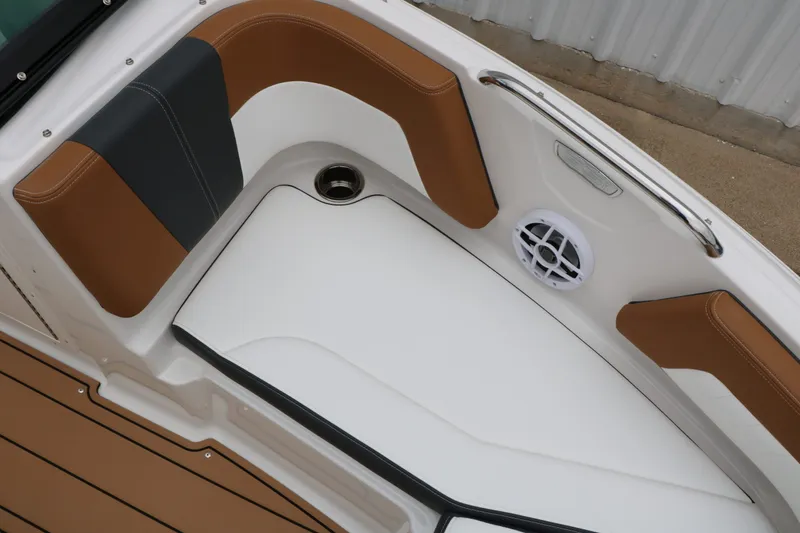 Slide: The Image of Interior of 2026 Chaparral 21 SSi with brown and black seating. - 31