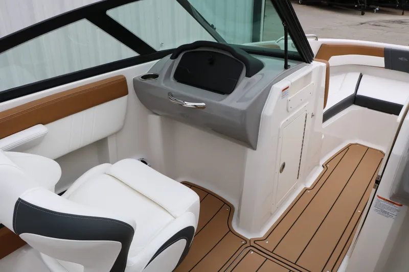 Slide: The Image of Interior of 2026 Chaparral 21 SSi featuring modern seating and dashboard. - 34