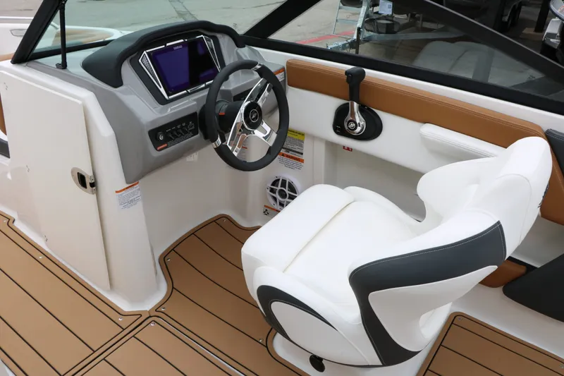 Slide: The Image of Interior of 2026 Chaparral 21 SSi with steering console and seat. - 35