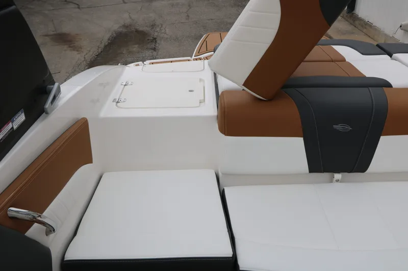 Slide: The Image of Interior of 2026 Chaparral 21 SSi with brown and white seating. - 43