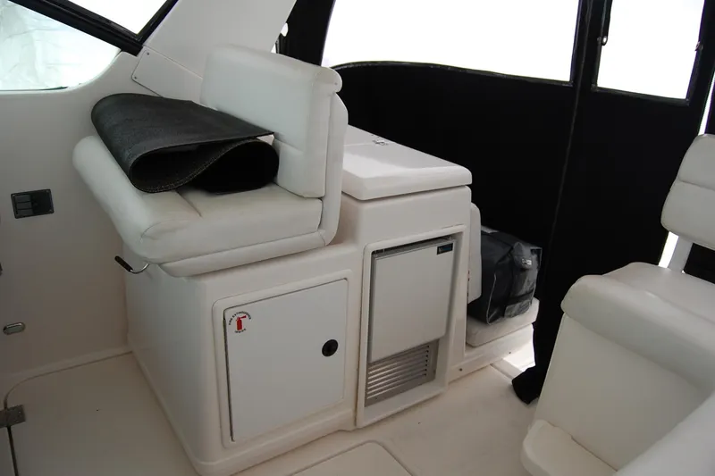 Slide: The Image of 2004 Tiara Yachts 3500 Open interior with seating and storage compartments. - 3