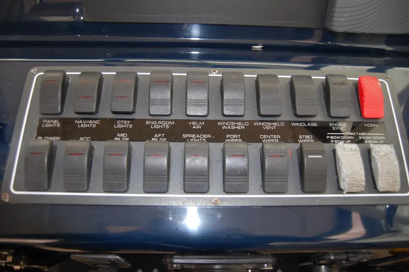 Slide: The Image of Control panel of a 2004 Tiara Yachts 3500 Open, featuring various switches and labels. - 7