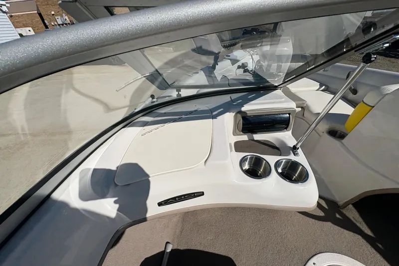 Slide: The Image of 2005 Tahoe Q4 SF boat interior with cup holders and dashboard. - 18