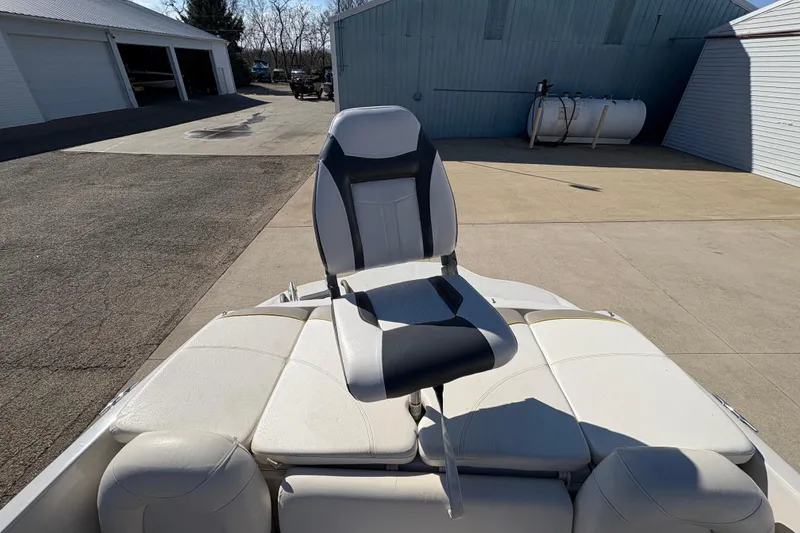 Slide: The Image of 2005 Tahoe Q4 SF boat seat in a sunny outdoor setting. - 22