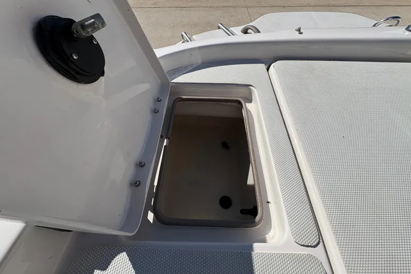 Slide: The Image of Open storage compartment on a 2005 Tahoe Q4 SF boat deck. - 23