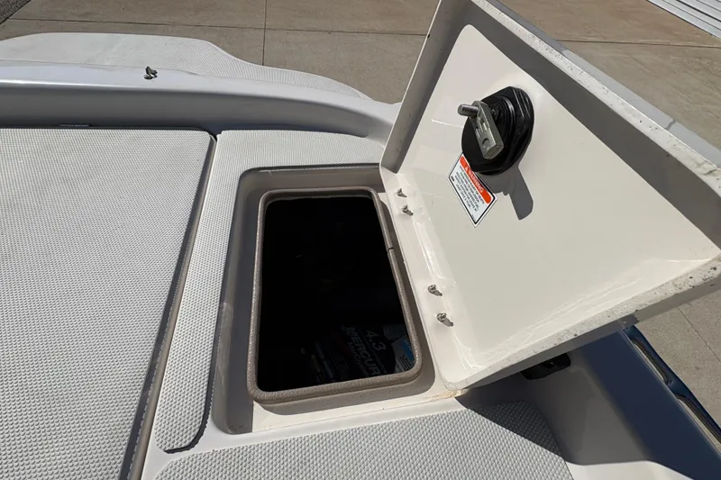 Slide: The Image of Open storage compartment on a 2005 Tahoe Q4 SF boat deck. - 24