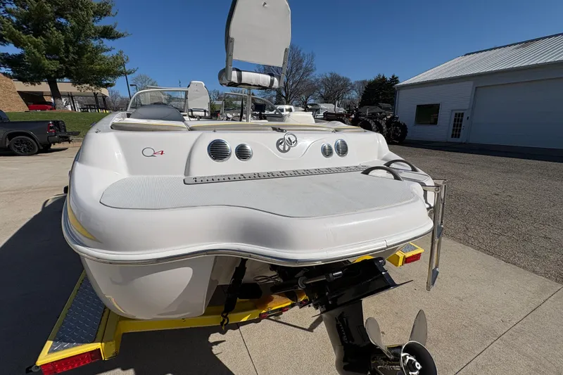 Slide: The Image of 2005 Tahoe Q4 SF boat on trailer, rear view, sunny day. - 26