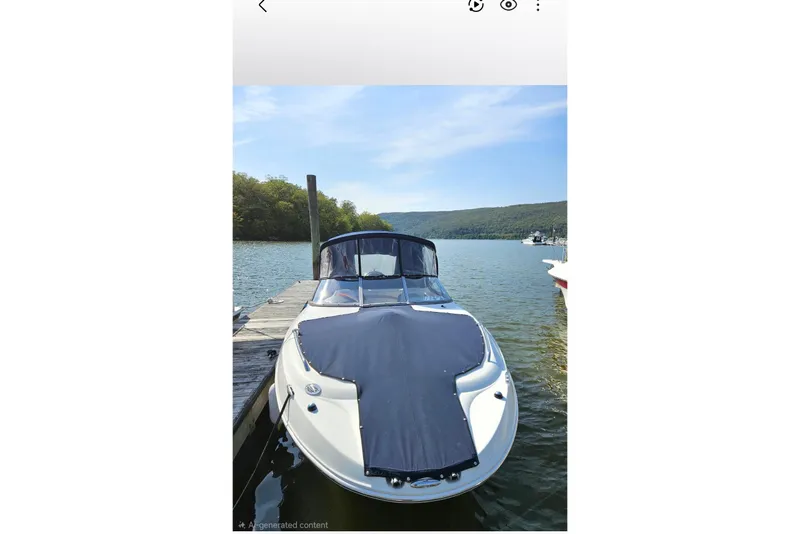 Slide: The Image of 2013 Stingray 234 LR boat docked on a serene lake with scenic hills. - 10
