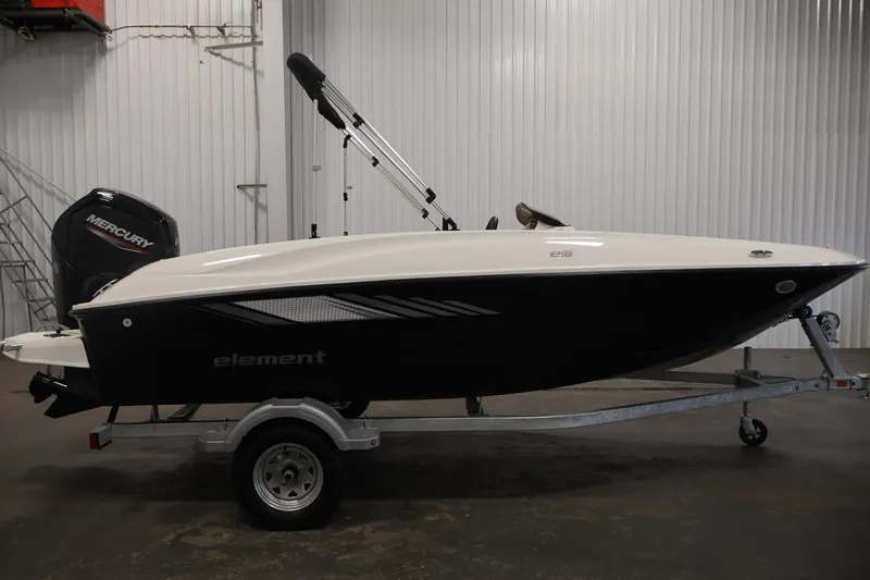 Slide: The Image of 2026 Bayliner Element E16 boat on trailer in indoor setting. - 10