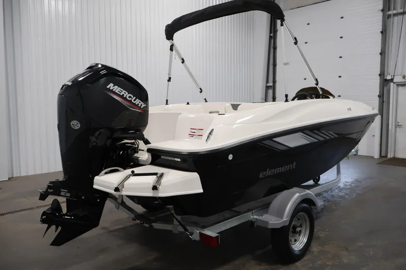 Slide: The Image of 2026 Bayliner Element E16 boat with Mercury engine in a garage setting. - 11