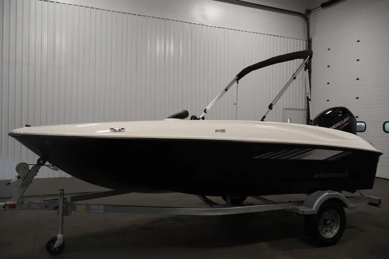 Slide: The Image of 2026 Bayliner Element E16 boat on trailer in indoor storage. - 14