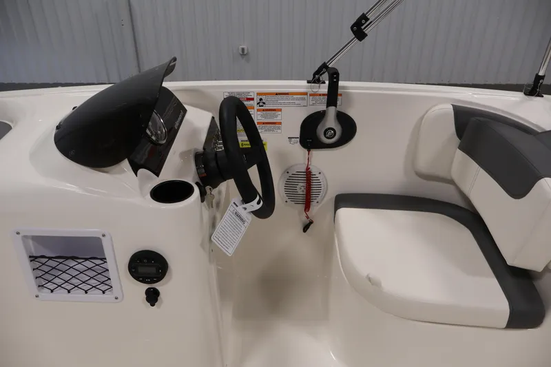 Slide: The Image of 2026 Bayliner Element E16 boat interior with steering wheel and seating. - 22