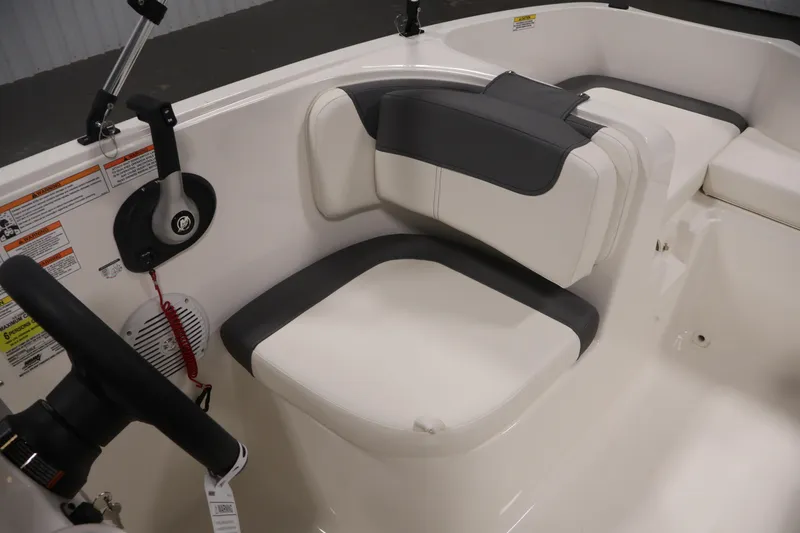 Slide: The Image of 2026 Bayliner Element E16 boat interior with white and gray seating. - 29
