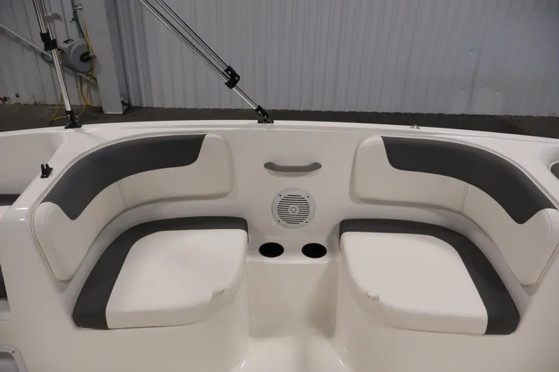 Slide: The Image of 2026 Bayliner Element E16 boat interior with cushioned seating and cup holders. - 31