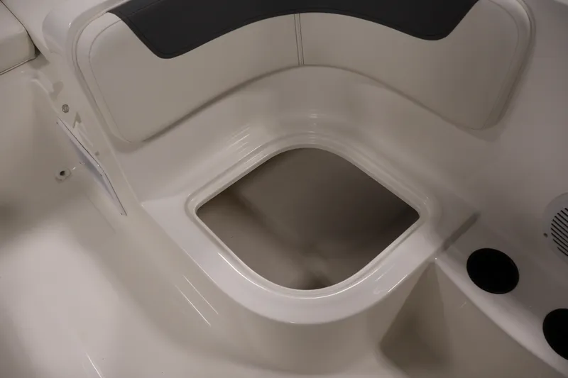 Slide: The Image of 2026 Bayliner Element E16 boat interior seating with storage compartment. - 33