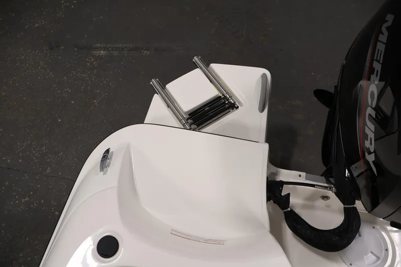 Slide: The Image of 2026 Bayliner Element E16 boat with Mercury engine and swim ladder. - 36