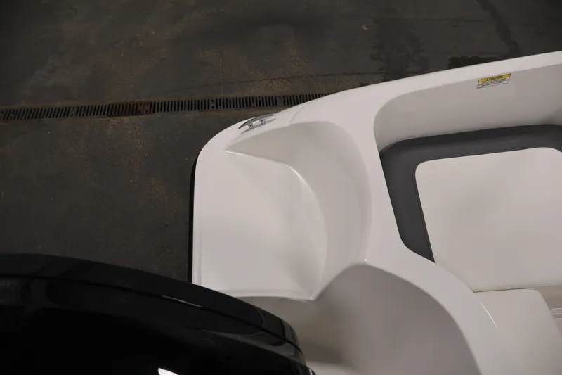 Slide: The Image of 2026 Bayliner Element E16 boat interior detail, featuring sleek white seating and modern design. - 37
