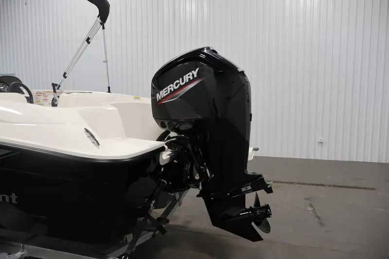Slide: The Image of 2026 Bayliner Element E16 boat with Mercury outboard motor in a showroom. - 39