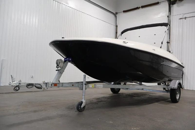 Slide: The Image of 2026 Bayliner Element E16 boat on trailer in indoor storage facility. - 44