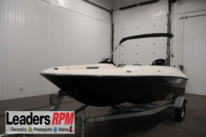 The Image of 2026 Bayliner Element E16 boat on trailer in indoor showroom. - 7