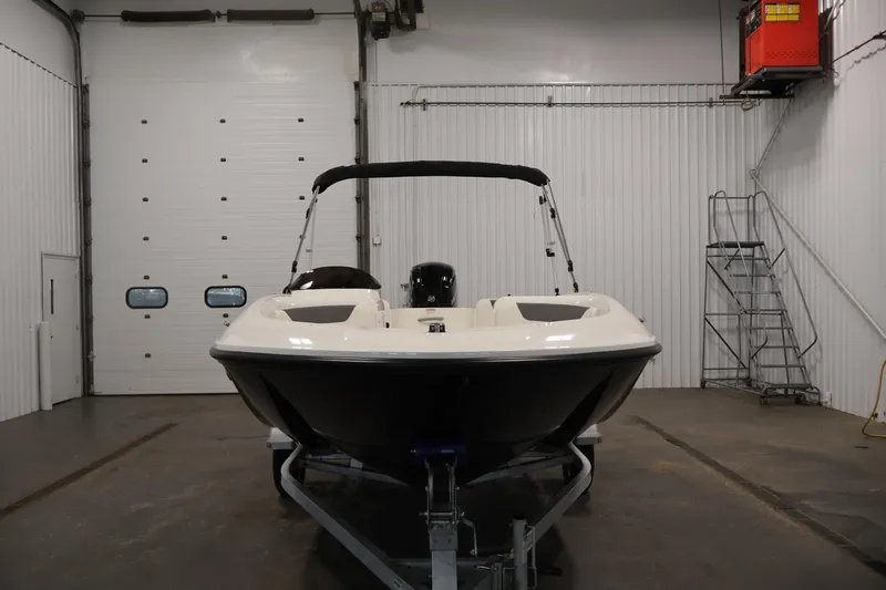 Slide: The Image of 2026 Bayliner Element E16 boat in indoor storage, front view. - 8