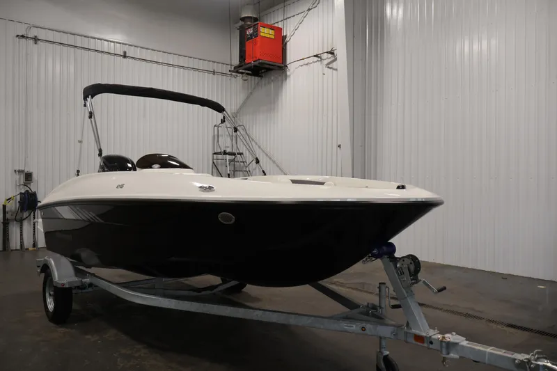 Slide: The Image of 2026 Bayliner Element E16 boat on trailer in indoor storage facility. - 9