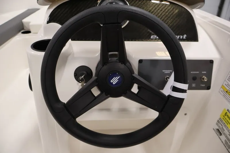 Slide: The Image of Steering wheel of 2026 Bayliner Element E16 boat, featuring sleek design and controls. - 17