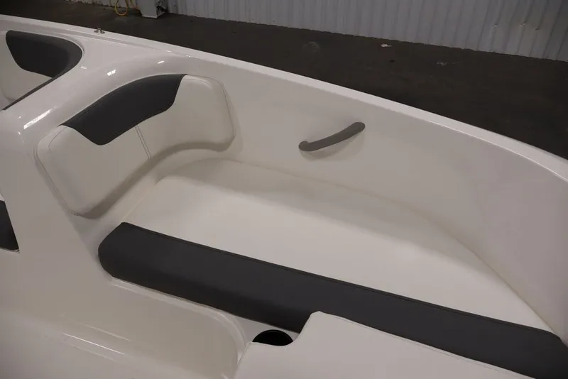 Slide: The Image of 2026 Bayliner Element E16 boat interior with cushioned seating and sleek design. - 14