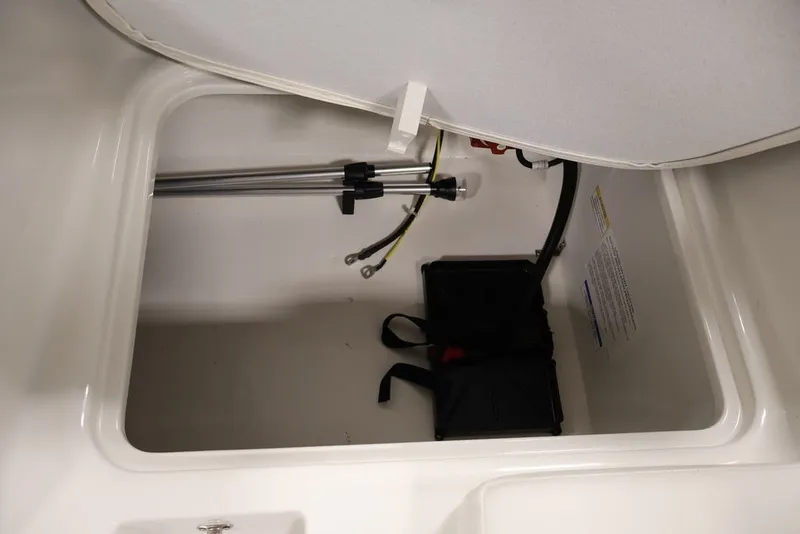 Slide: The Image of Storage compartment of 2026 Bayliner Element E16 boat, featuring hydraulic support. - 20