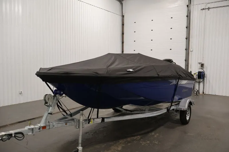 Slide: The Image of 2026 Bayliner Element E16 boat covered on trailer in indoor storage. - 33
