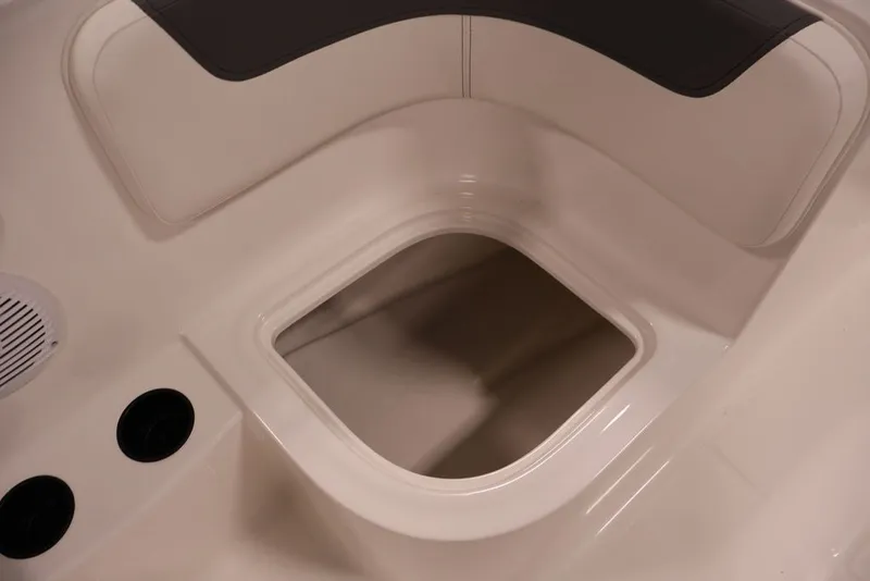 Slide: The Image of 2026 Bayliner Element E16 boat interior storage compartment with cup holders and speaker. - 39