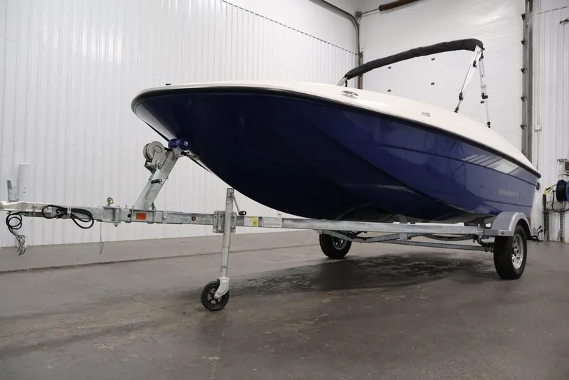Slide: The Image of 2026 Bayliner Element E16 boat on trailer in indoor storage facility. - 15