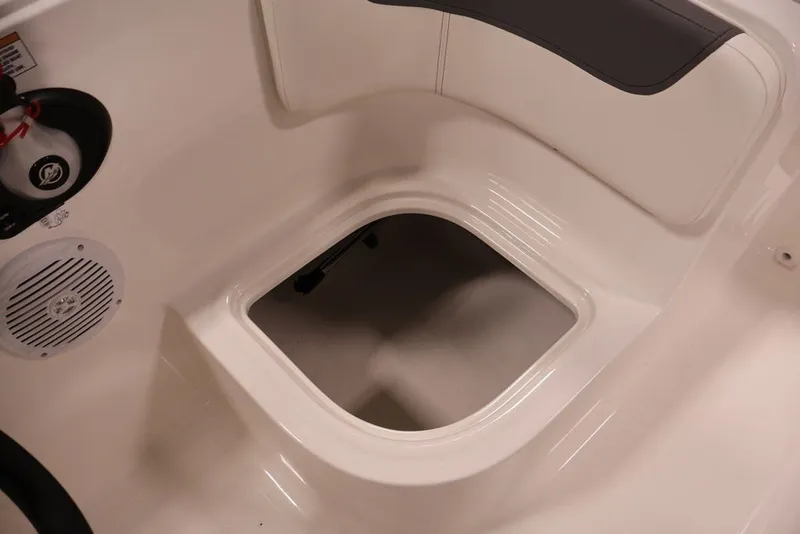 Slide: The Image of 2026 Bayliner Element E16 boat interior storage compartment with speaker and seating. - 30