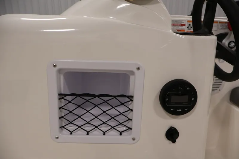 Slide: The Image of 2026 Bayliner Element E16 dashboard with storage compartment and control panel. - 19