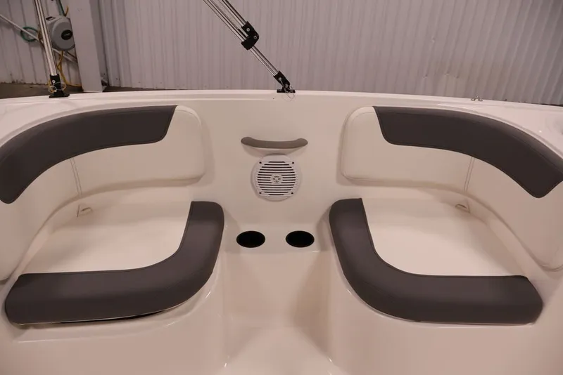 Slide: The Image of Interior seating of 2026 Bayliner Element E16 boat with gray cushions and cup holders. - 28