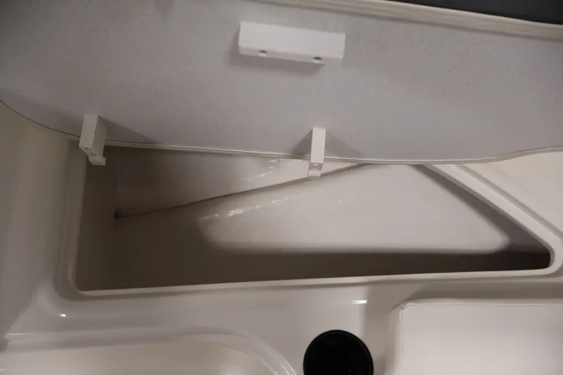 Slide: The Image of Storage compartment of 2026 Bayliner Element E16 boat, showcasing interior design. - 24