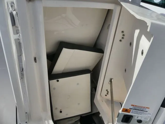 Slide: The Image of Storage compartment in 2023 Robalo R222 Explorer boat. - 12