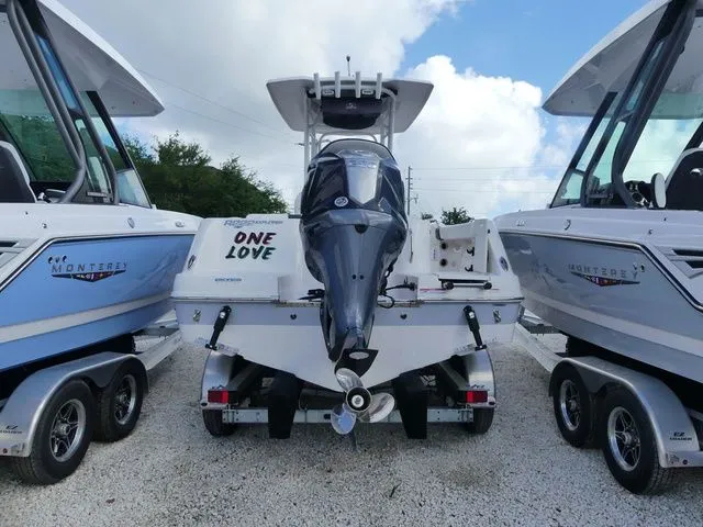 Slide: The Image of 2023 Robalo R222 Explorer between two Monterey boats. - 3