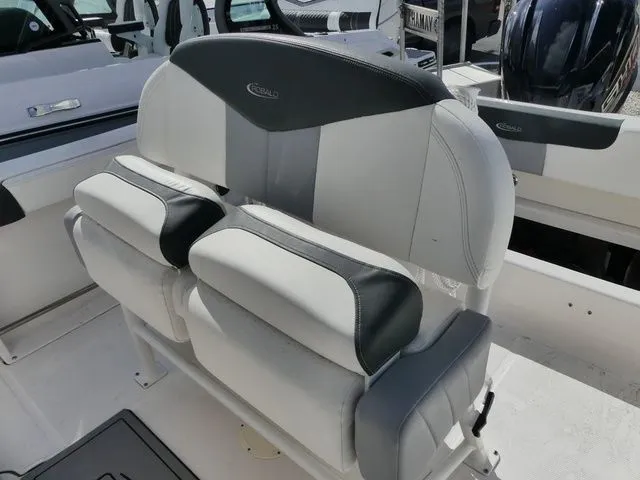 Slide: The Image of 2023 Robalo R222 Explorer boat seat with gray upholstery. - 9