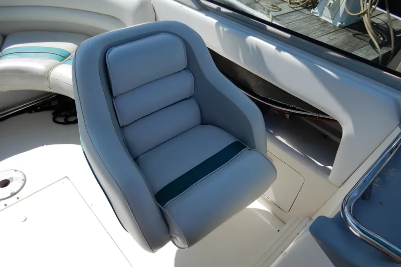 Slide: The Image of Gray captain's chair on 1994 Sea Ray 310 Sun Sport boat deck. - 10