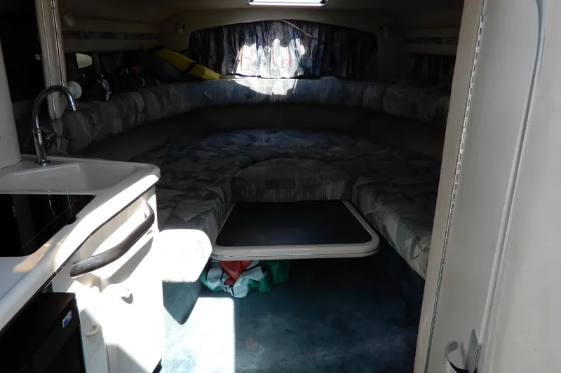 Slide: The Image of Interior cabin of 1994 Sea Ray 310 Sun Sport boat with seating and kitchenette. - 20